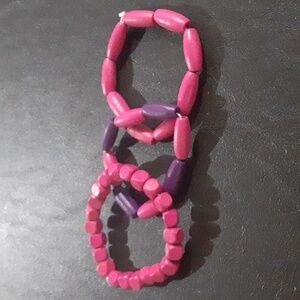 🌹 Purple and pink wooden bracelets.